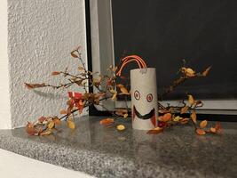 Creative Halloween Decoration with Autumn Leaves photo