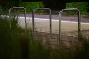Metallic Bike Racks in Dim Light photo