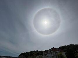 Moon Halo in Cloudy Sky photo