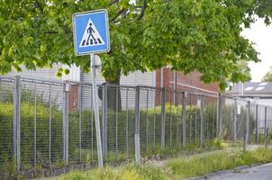 At the port of Flensburg there is a zebra crossing with a road sign photo