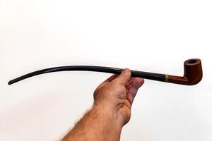 Hand holding luxurious pipe in selective focus and smooth background 4 photo
