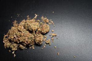 Marijuana Displayed on a Dark Surface With Details Visible photo