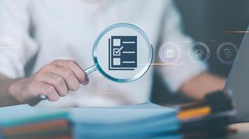 plan review process and assess correctness ,Management of important document storage of organization ,document system ,accountant Audit documents,Accountant showing office document auditing concept photo