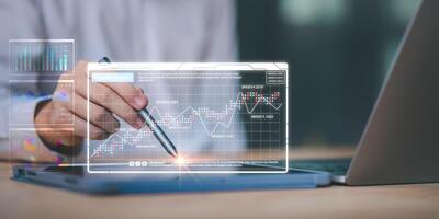 manage financial and marketing documents, update annual budget accounts, company growth data,Business people read business statistics chart reports, to analyze and improve corporate strategy photo