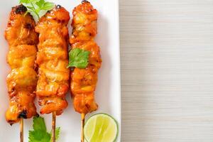 grilled chicken skewer with herbs and spices - Street food style. photo