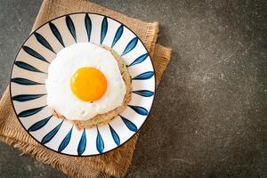 fried rice with pork and fried egg in Japanese style. photo