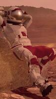 3d rendering. Astronaut sitting on Mars and admiring the scenery. Exploring Mission To Mars. Futuristic Colonization and Space Exploration Colony on Mars. video