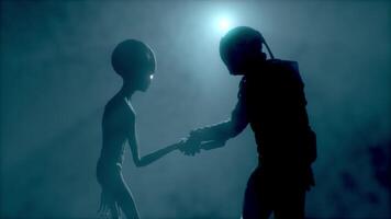 3d weergave. astronaut voldoet aan een grijs buitenaards wezen en schudt zijn hand. eerste contact. buitenaards wezen Aan maan. kolonisatie en ruimte exploratie concept. volumetrisch licht.. ufo futuristische concept. video