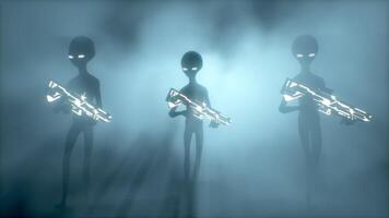 3D rendering. Scary gray aliens with weapons in their hands walk into the volumetric light. video