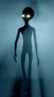 3D rendering. Scary gray alien walks and looks blinking on a dark smoky background. UFO futuristic concept. video