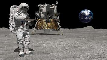 3d rendering. Astronaut on moon typing on a laptop. video