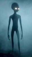 3D rendering aniation. Portrait of Scary gray alien stands and looks blinking on a dark smoky background. UFO concept. video