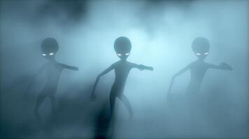 3D rendering. Scary gray aliens dancing on a dark smoky background. UFO. video