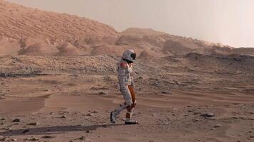 3d rendering. Astronaut walking on Mars red desert landscape. Space exploration mission concept with rocky terrain and mountains under orange atmosphere. video
