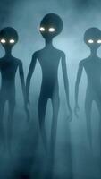 3D rendering. Three Scary gray aliens walks and looks blinking on a dark smoky background. UFO futuristic concept. video