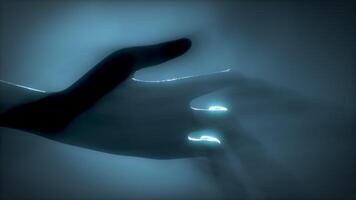 3D rendering. Close-up of an alien's hand in volumetric light. UFO futuristic concept. video