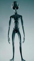 3D rendering. Scary gray alien stands and looks blinking on a dark smoky background. UFO futuristic concept. video