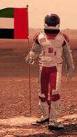 3d render. Astronaut walking on Mars with UAE flag. Exploring Mission To Mars Red Planet. Futuristic Colonization Space Exploration. video