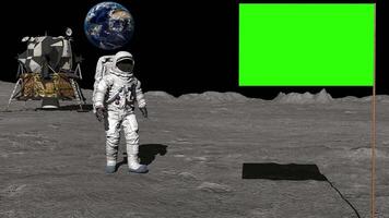 3D rendering. Astronaut on the moon saluting the Green screen flag. video