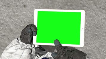 3d rendering. Astronaut on moon typing on a laptop with green screen. video