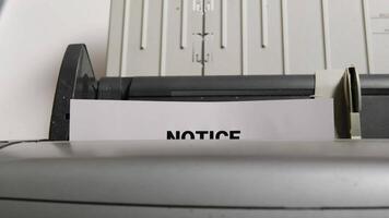 Close-up of printer printing a termination of employment notice in an office setting with a serious tone video