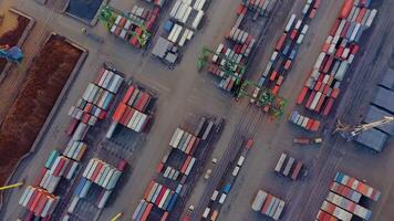 Aerial view from a rotating drone of the cargo area of the port with containers, bulk cargo, cranes. video
