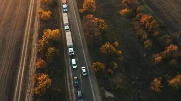 Aerial view of a traffic jam from vehicles on an evening country road. video