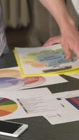 Engaging close-up of a corporate table brimming with colorful business diagrams video