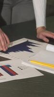 Engaging close-up of a corporate table brimming with vibrant business diagrams video