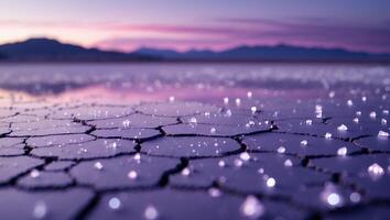 Cracked Earth Landscape with Salt Crystals at Colorful Sunset photo
