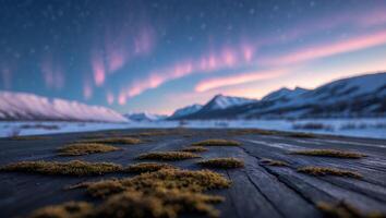 Mossy Wood Surface with Aurora Borealis and Snowy Mountain Backdrop photo