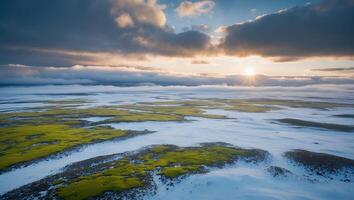 Scenic Snowy Landscape with Moss Patches and Sunrise Aerial View photo