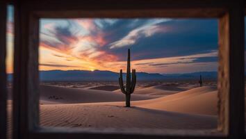 Viewing Desert Cactus at Sunset Through Window Frame with Colorful Sky photo