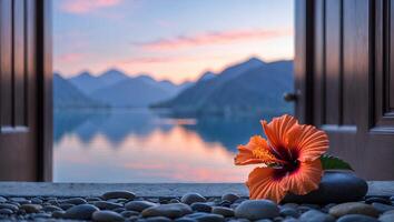Orange Hibiscus Flower at Open Door with Lake and Mountain View photo