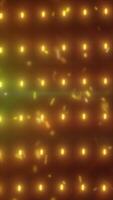 Warm glowing grid of golden lights with soft bokeh and flying particles on dark background video