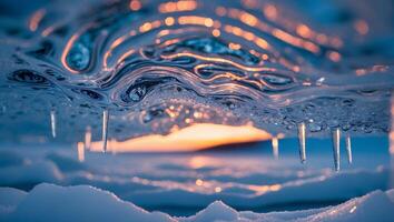 Icy Landscape with Snow and Icicles During Golden Hour Sunset photo