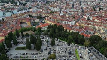 Aerial view of a large cemetery, urban buildings. Numerous gravestones and pathways, peaceful resting place. Memory, mortality, the passage of time, investigative journalism, unusual landmarks video