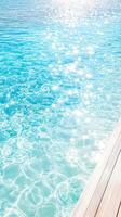 A tranquil view of sparkling blue water, reflecting sunlight, perfect for relaxation and nature appreciation. photo