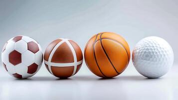 A collection of various sports balls including soccer, basketball, and golf on a minimalistic background photo