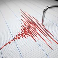 Earthquake recording seismograph. The needle draws red lines on the paper indicating strong tremors. photo