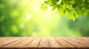 Blank wooden table, table top on green blurred background with bokeh effect, green leaves on top and sunlight. For displaying products photo