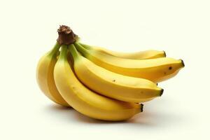 A bunch of fresh yellow bananas isolated against a plain white background healthy fruit photo