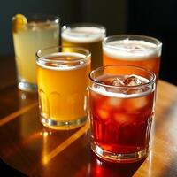 Serving Assorted Drinks with Ice in Glasses on a Wooden Table photo