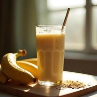 Banana Smoothie in Glass with Oats and Fresh Bananas photo