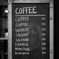 Coffee Menu on Chalkboard with Various Options and Prices photo