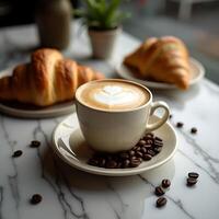 Coffee Cup with Latte Art and Croissants on Marble Table photo