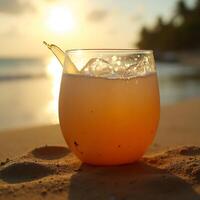 Refreshing Drink on Beach at Sunset with Ice Cubes photo