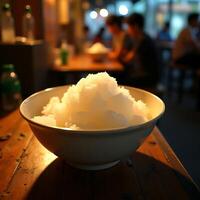 Shaved Ice Dessert in Bowl on Wooden Table at Restaurant photo