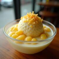 Dessert Bowl with Creamy Sauce and Yellow Toppings photo