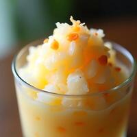 Serving Refreshing Fruit Slush with Small Orange Garnish in a Glass photo